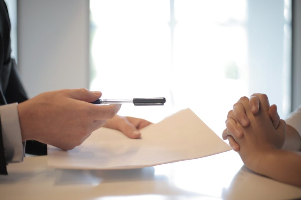 handing over car docs and payment