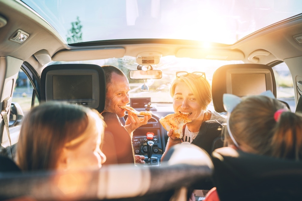 keep your car clean for better value - family eating in car