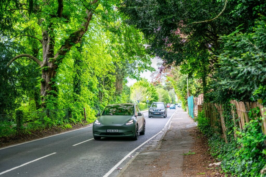 tesla driving on a road