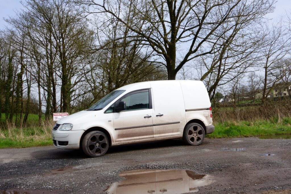 a small white panel van 