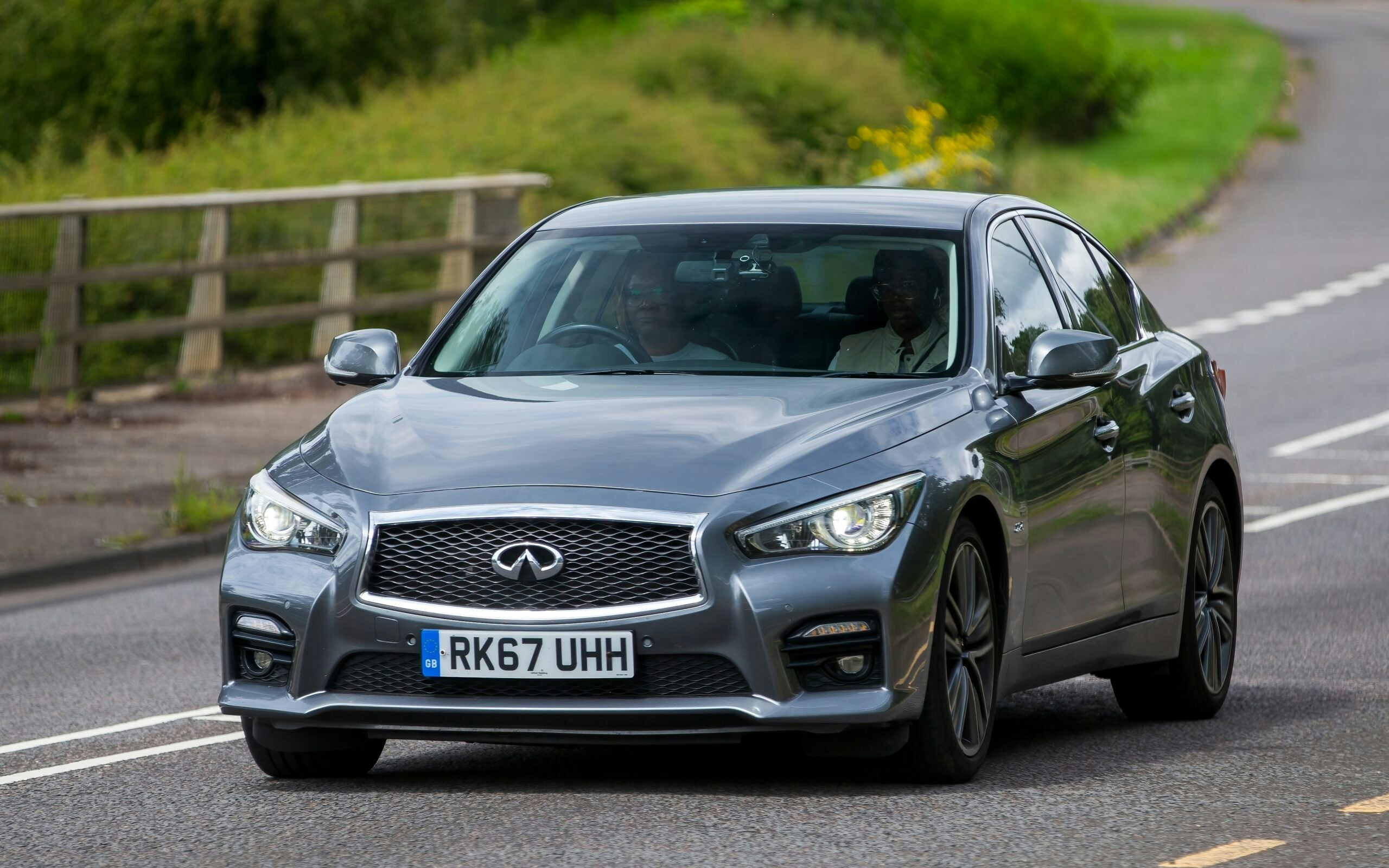 two men in an infiniti car 