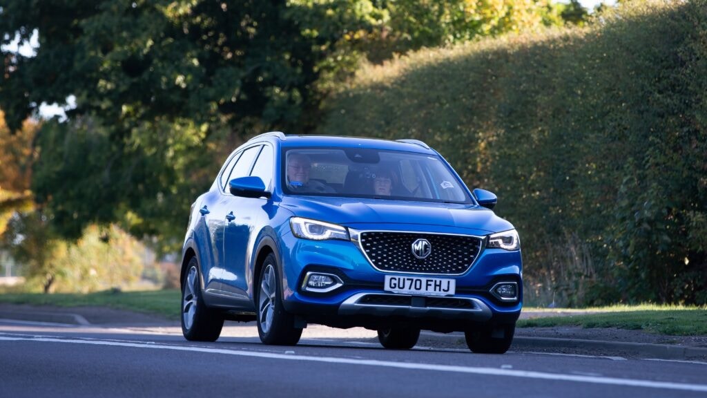 a blue MG on the road