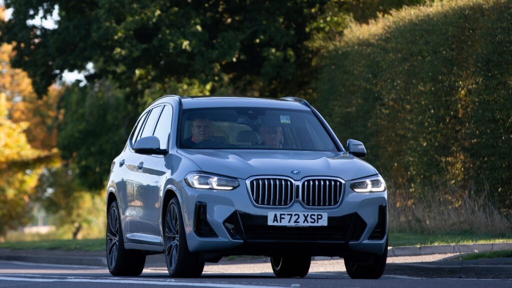 two men in a BMW X3