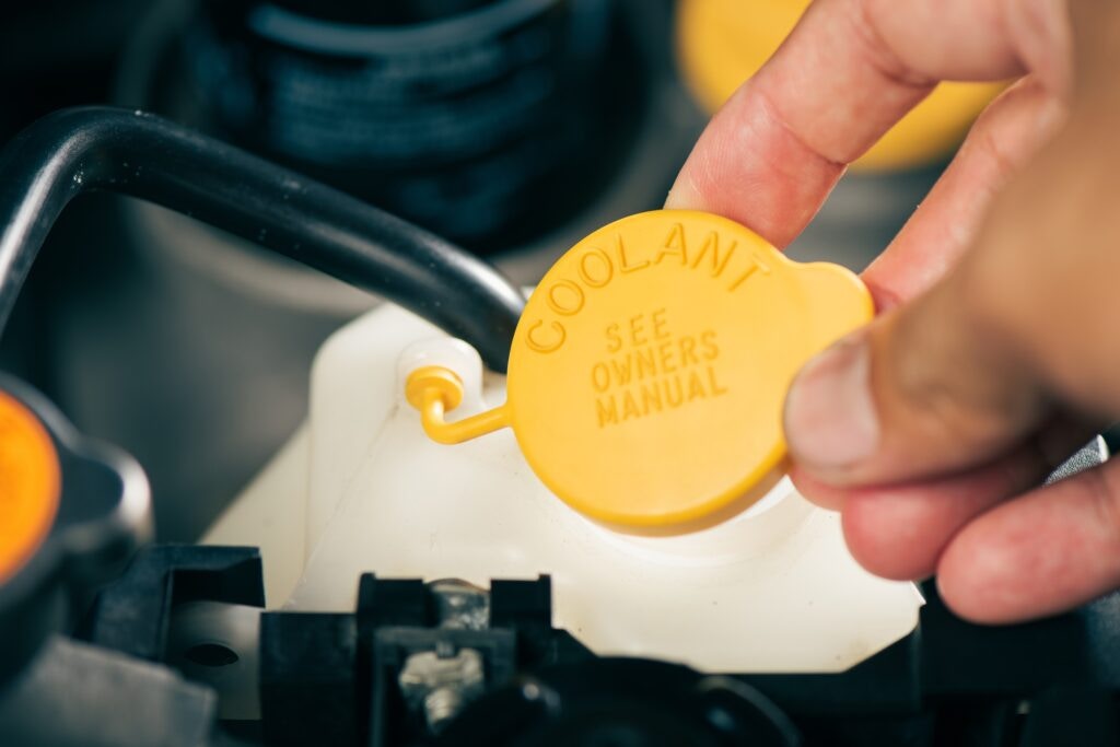 a yellow engine coolant cap