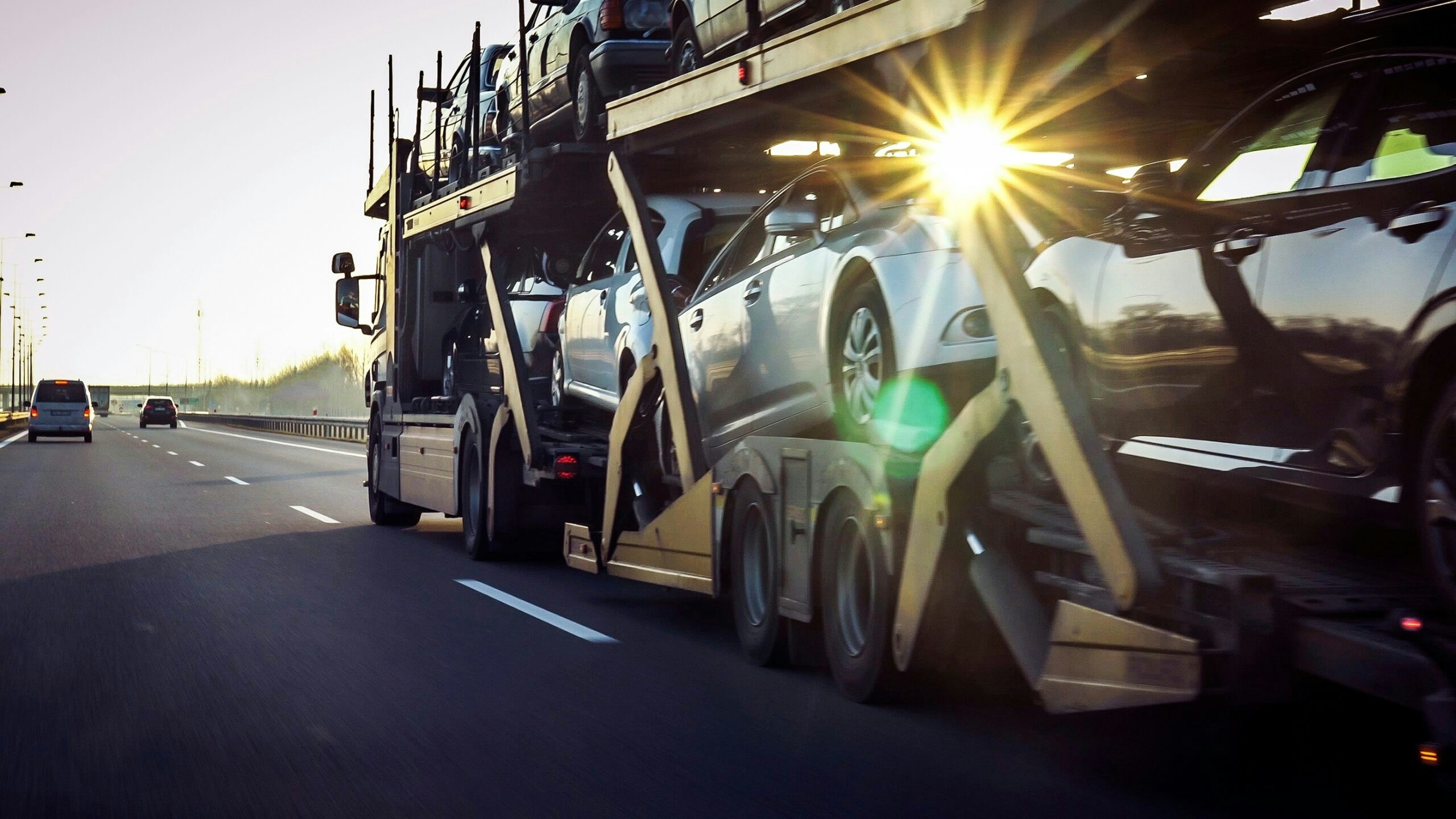 a truck carrying cars