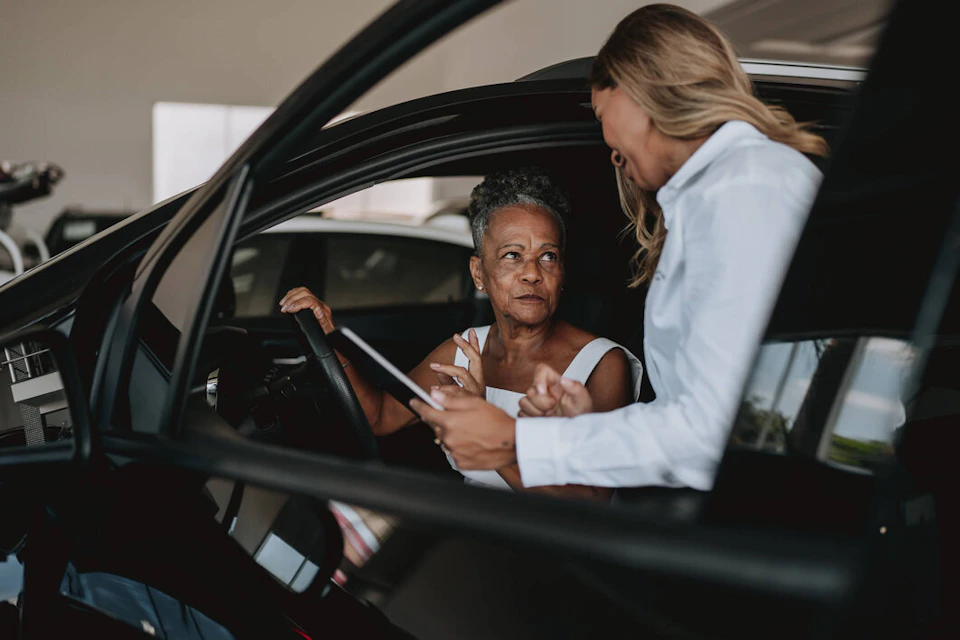 women talking about the vehicle