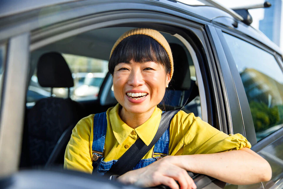 woman laughing in a car